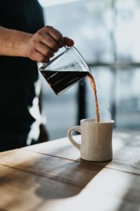 pouring coffee in a cup