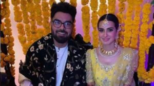 Iqra Aziz and Yasir sitting on their wedding