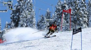 a man snow skating down a hill in Malam Jabba