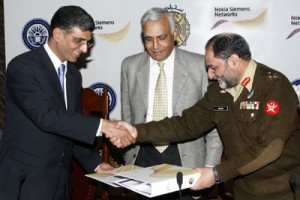 Saad M. Waraich Country Director Nokia Siemens Networks Pakistan exchanging document with Major General Muhammad Shahid Commandant College of Electrical & Mechanical Engineering (NUST) after signing an MOU. Also seen Air vice Marshal Asif Raza Pro Rector Academics and Research NUST