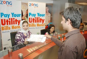 Zong has now introduced new standards of Customer Facilitation by providing them Utility Bill Payment facility at all Zong Customer Service Centers (CSC). Picture shows Zong's first customer is paying his bill