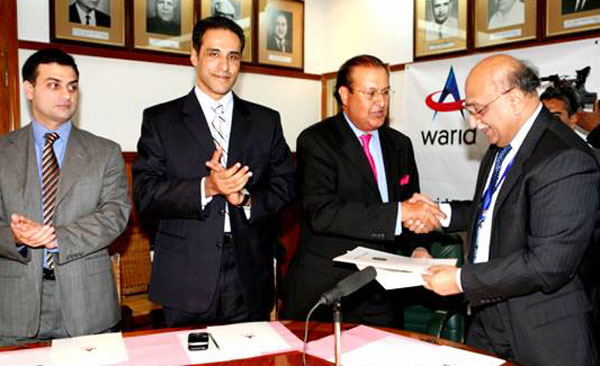 Warid Telecom (Pvt.) Ltd. signs MoU with Punjab University, the largest University of Pakistan. Seen in the picture from right  Dr. Mujahid Kamran, Vice Chancellor Punjab University exchanging MoU documents with Shahid M. Murtaza, General Manager Corporate Accounts and Enterprise Solutions, Warid Telecom along with Shahzad Rauf , Chief Strategy Officer Warid Telecom & Akbar Khan, Head of Corporate Sales and Strategic  Alliances, Warid Telecom.