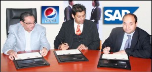 (L-R) Mr. Siraj Kassim Teli-Director Pakistan Beverage Limited, Mr. Adnan Bashir Khan, CEO Virtual Matrix Synergies and Mr. Sajjad Syed, Head SAP Pakistan, during the agreement signing Ceremony