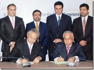  Nadeem Hussain, President Tameer Microfinance Bank (left) and Captain Nadeem Khan Yousufzai, Managing Director PIA signing the agreement in the presence of officials of Tameer Bank, Telenor Pakistan and PIA