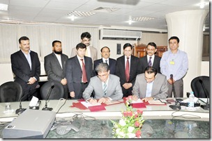 CEO-USF, Parvez Iftikhar (L) and Director (Projects) Oratier, Zia ul Islam (R) signing Telemedicine contract. Federal Secretary IT, Mr. Saeed Ahmad Khan at the Ministry of IT also seen in the picture