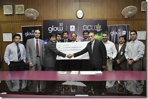 (From Left) Mr. Amer Aman, Warid Head of Sales while giving cheque of Rs 800,000 to the Vice Chancellor of GCU for GCU Endowment Fund Trust. 