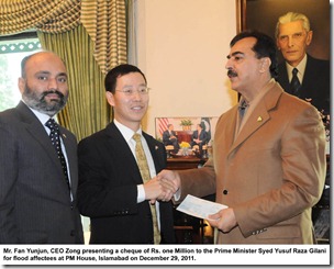 Mr. Fan Yunjun, CEO Zong presenting a cheque of Rs. one Million to the Prime Minister Syed Yusuf Raza Gilani for flood affectees at PM House, Islamabad on December 29, 2011. 