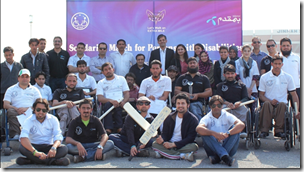 : Group photo of Telenor Pakistan's employees with persons with disabilities after a solidarity Cricket match under Telenor Hum Qadam program.
