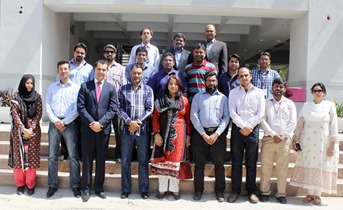 A group picture shows journalists with trainers and Zong representatives