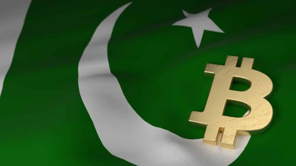 bitcoin logo on pakistani flag