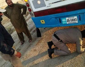 Person hiding underneath bus Karachi Peshawar
