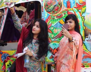 two girls taking selfies at karachi food festival