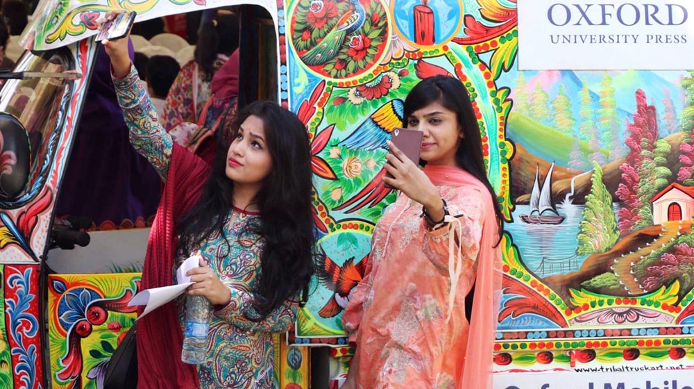two girls taking selfies at karachi food festival