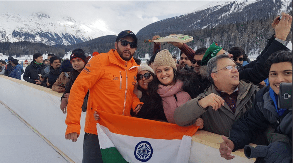 Shahid Afridi holding indian flag with fan
