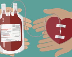 Blood bag and hand of donor with heart