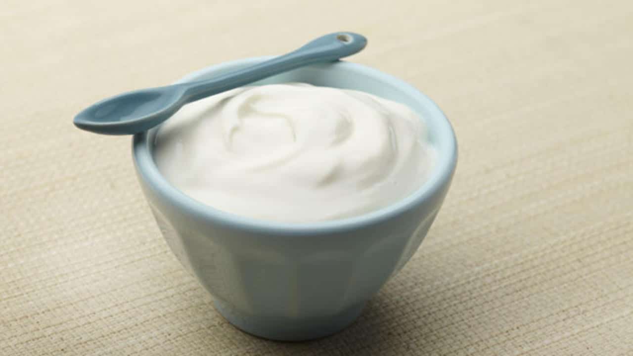 Yogurt with blue spoon 