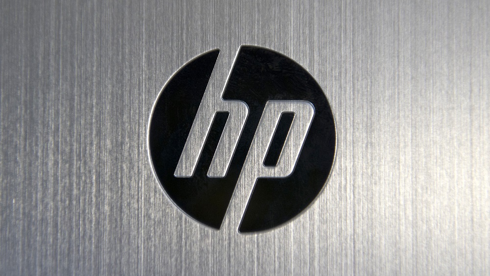 Black HP or Hewlett Packard logo on metallic silver background