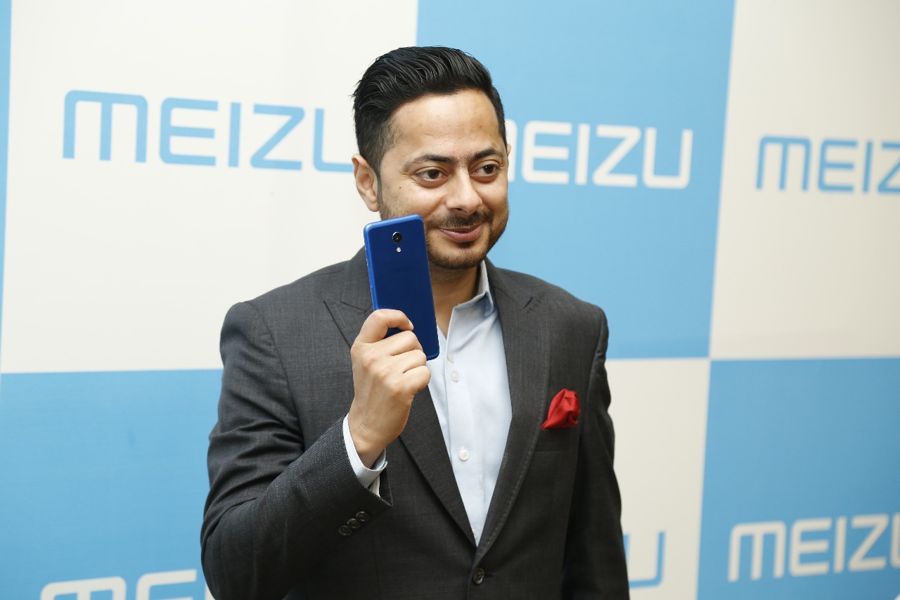 Holding Meizu Phone