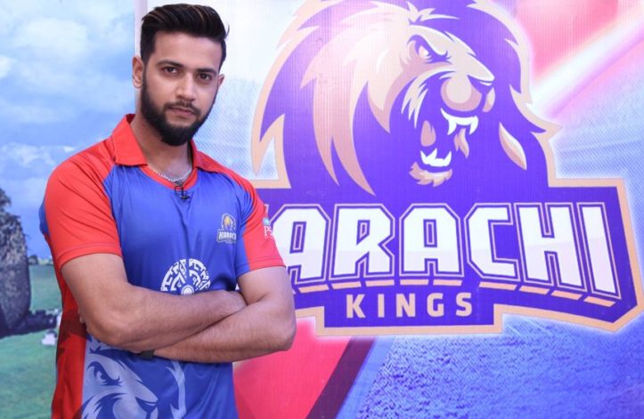 imad wasim infront of karachi kings poster