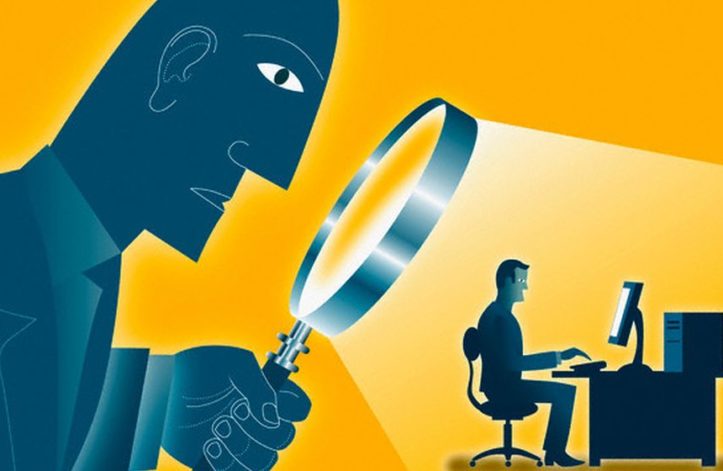 Large Man Looking At Co-Worker With A Magnifying Glass