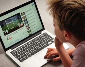 A Child watching Youtube videos on a laptop computer