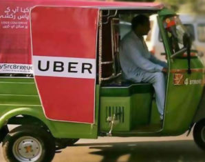 man driving uber rickshaw