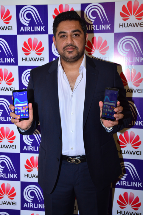 Man holding Huawei Y9 2018