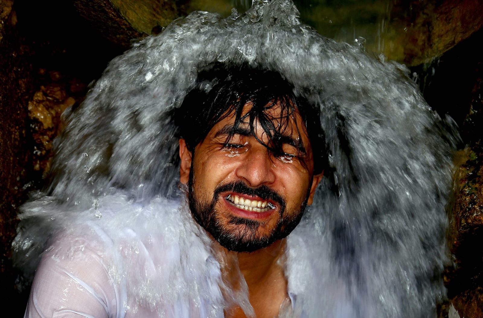 man taking shower in karachi