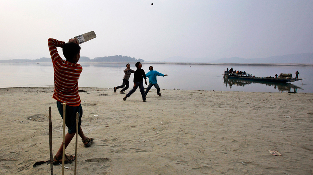 childrens playing cricket