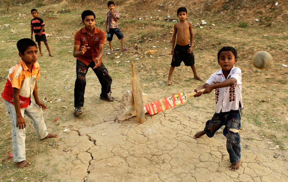 children playing cricket in dhaka bangladesh
