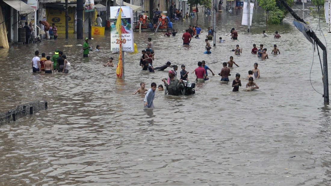 Childrens swimming in lahore roads after rain