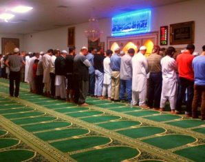 Muslims praying in Masjid
