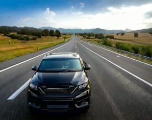 Black car driving fast
