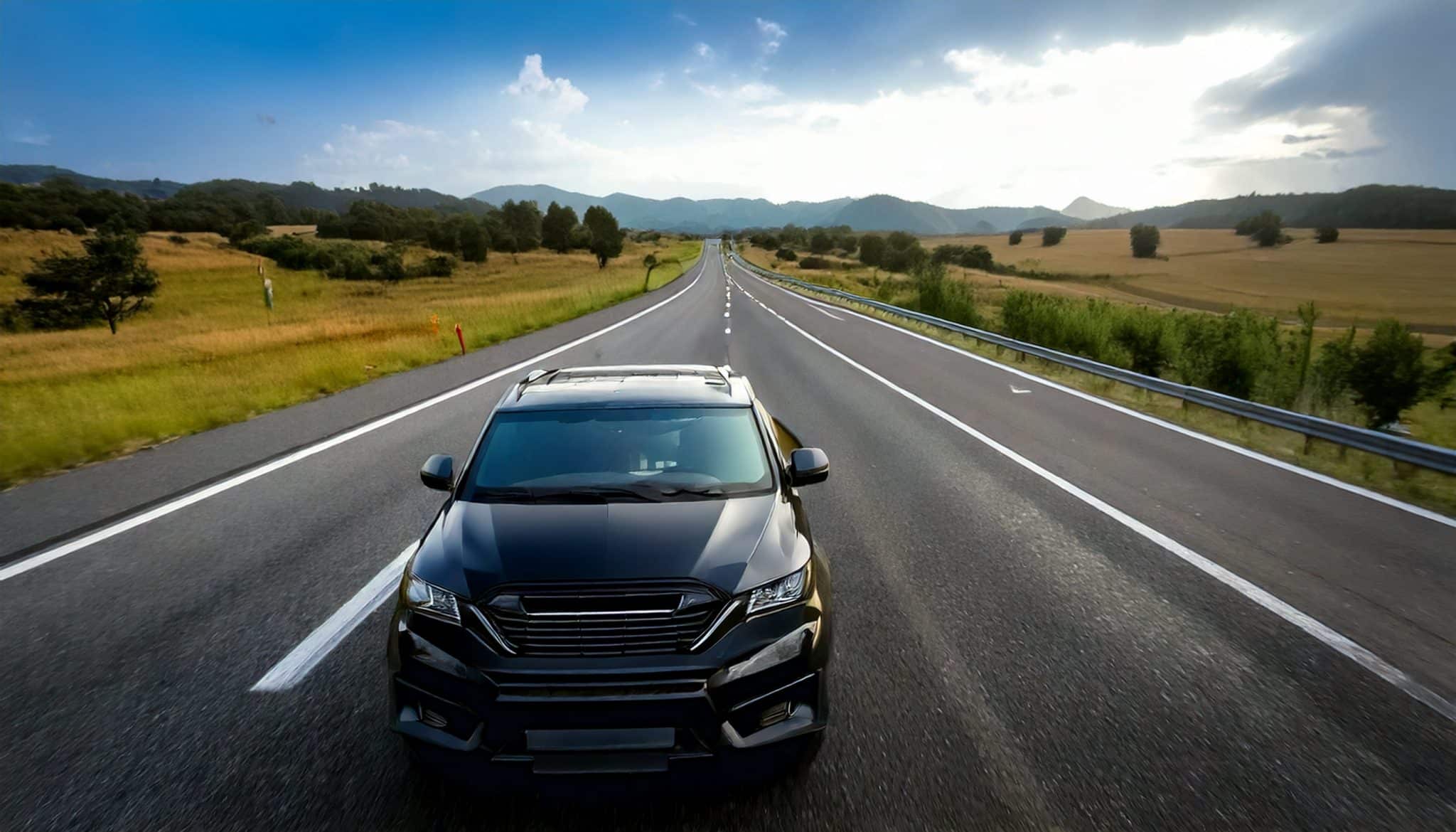 Black car driving fast