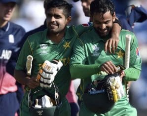 Mohammad Hafeez and Babar Azam walk back after a win