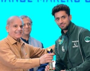 Ammad Butt during a ceremony with the PM