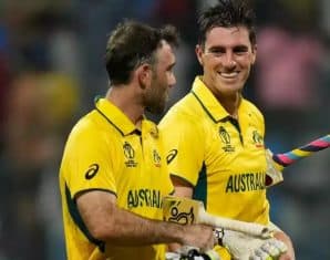 Glenn Maxwell and Pat Cummins walk back after a game