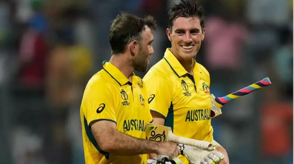 Glenn Maxwell and Pat Cummins walk back after a game