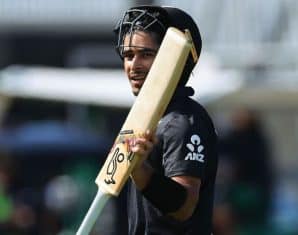 Muhammad Abbas raises his bat after his innings