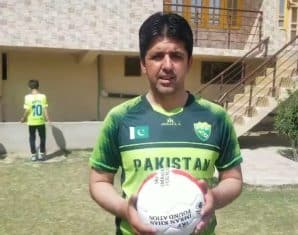 Muhammad Essa Khan with a football