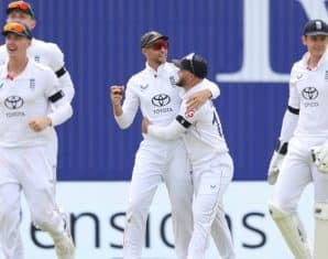 Joe Root celebrates taking a catch