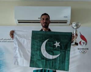 Pakistani athlete celebrates winning gold at Al Bareh Sailing Regatta in Bahrain