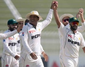 Sajid Khan walks back after an innings