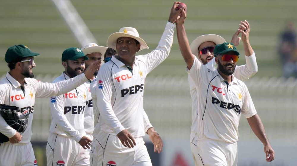 Sajid Khan walks back after an innings