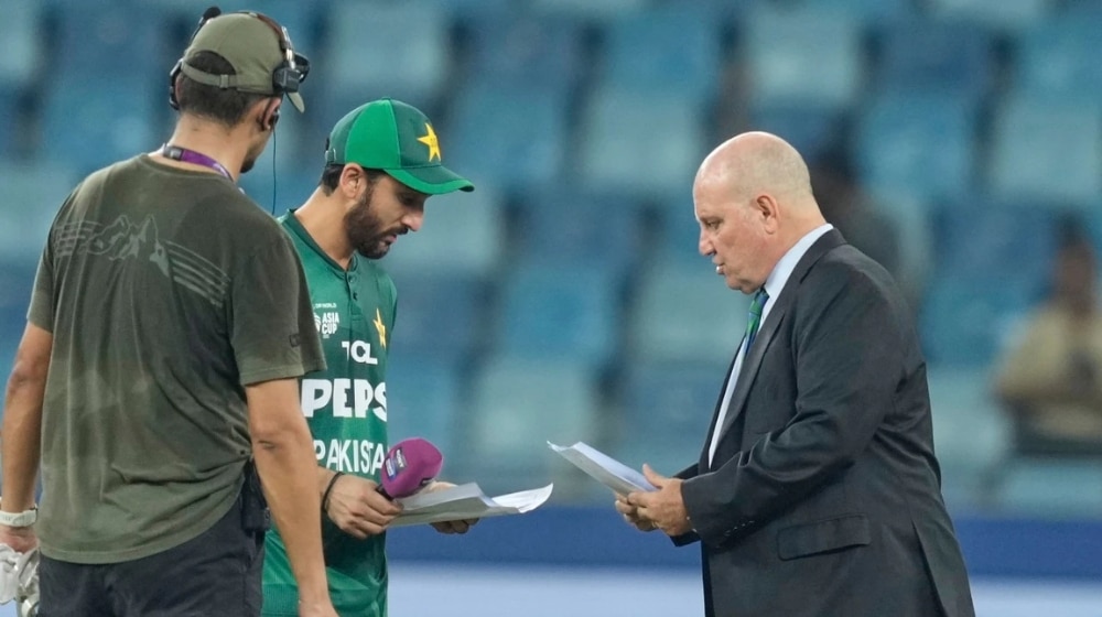 Andy Pycroft and Salman Ali Agha during an exchange before the toss