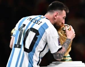 Lionel Messi with the World Cup trophy