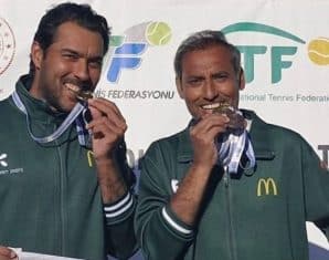 Aisam Ul Haq on a podium with his teammate