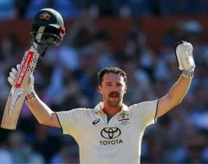 Travis Head celebrates his century