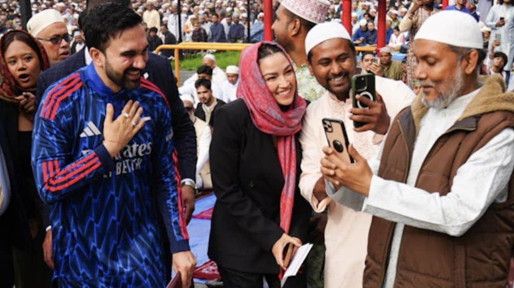 Mayor Zohran Mamdani wearing a custom Arsenal thobe during Eid al-Adha prayers